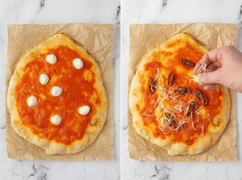 Mozzarella balls and shredded cheese being added to naan pizzas with sauce.